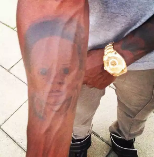 [PHOTOS]: FATHERLY!!! Obafemi Martins Tattoos His Son’s Face On His Arm
